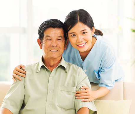 caregiver and elderly smiling
