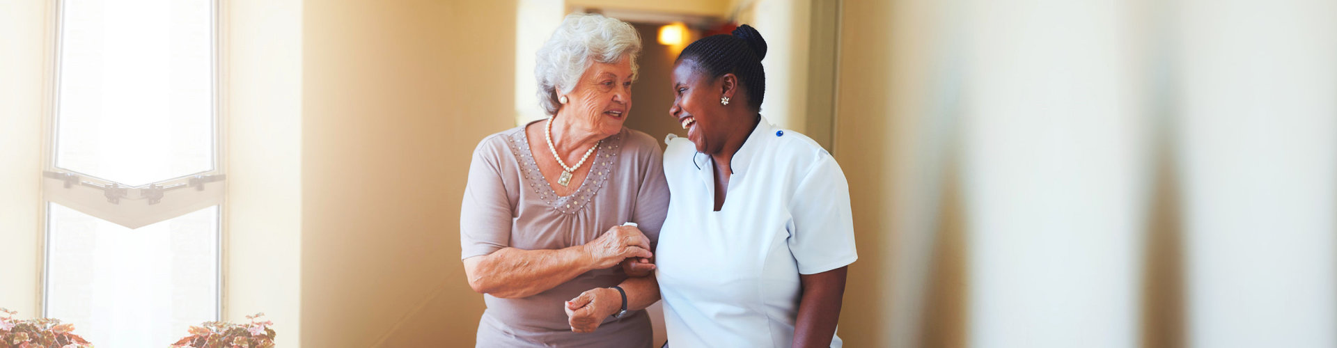 elderly and caregiver walking