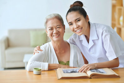 caregiver hugging the elderly