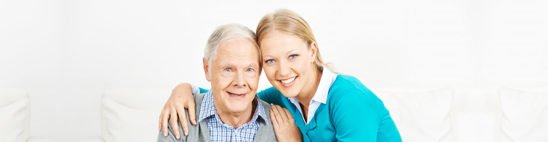 caregiver and elderly smiling
